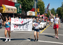 Photo: AIDS Vancouver team of volunteers participating in the Vancouver Pride Parade and Festival 2012. Photo Credit: Deni Daviau