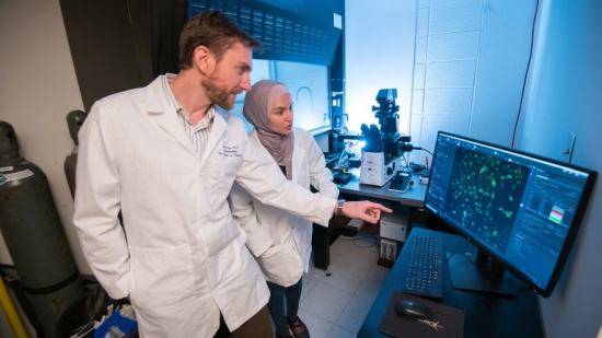 Archive Photo: Jason Paris (left) and fourth-year graduate student Alaa Qrareya