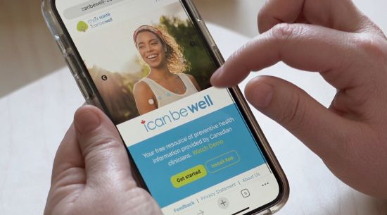 Fingers scrolling through icanbewell app on mobile phone. icanbewell.ca